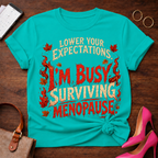 T-Shirt — "Lower Your Expectations. I'm Busy Surviving Menopause" Vintage Quote Tee