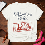 I Manifested Peace Tee — "It's On Backorder" Funny Shirt