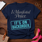 I Manifested Peace Tee — "It's On Backorder" Funny Shirt